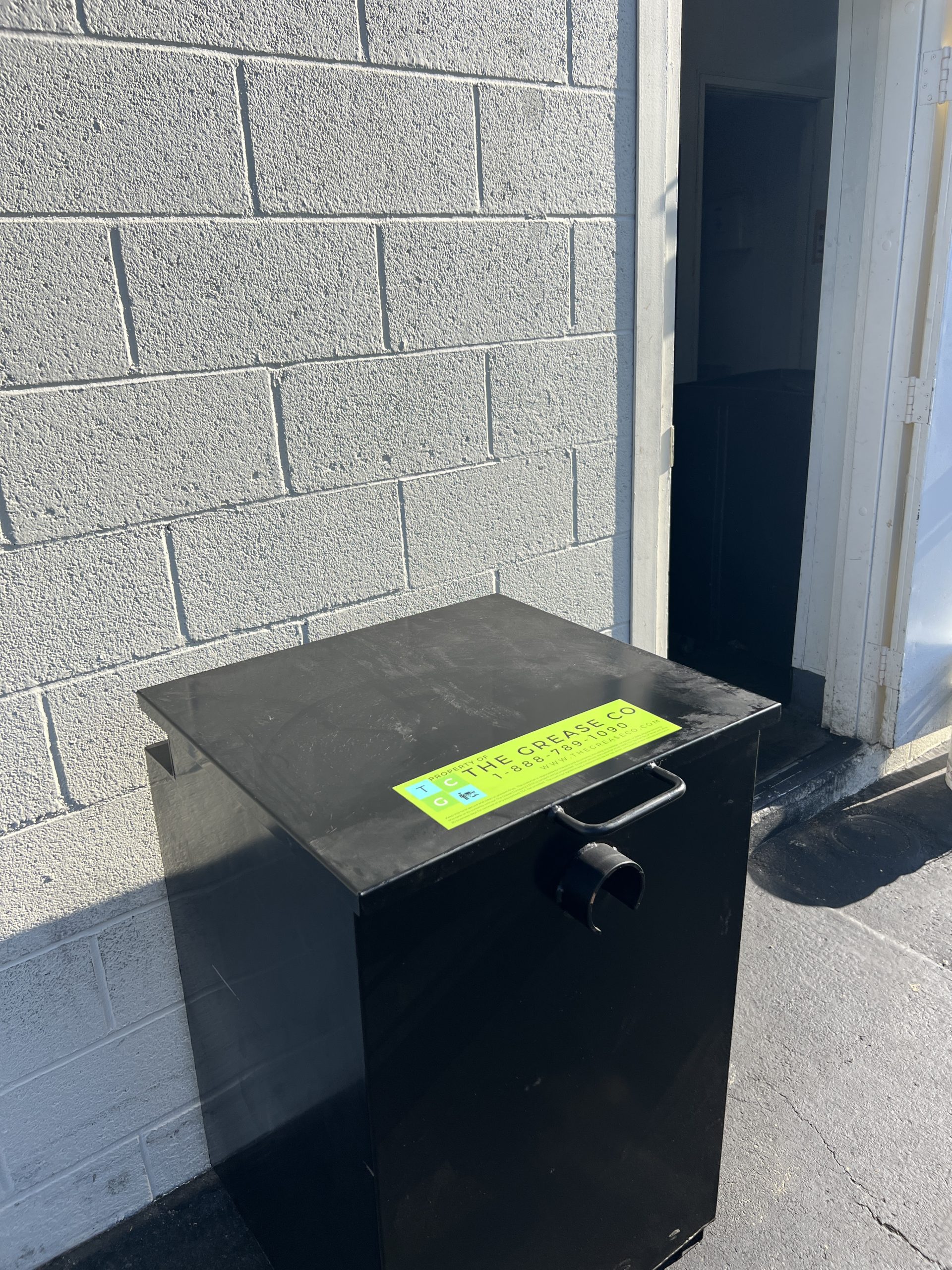 Commercial Cooking Oil Storage unit featuring grease management services company logo.