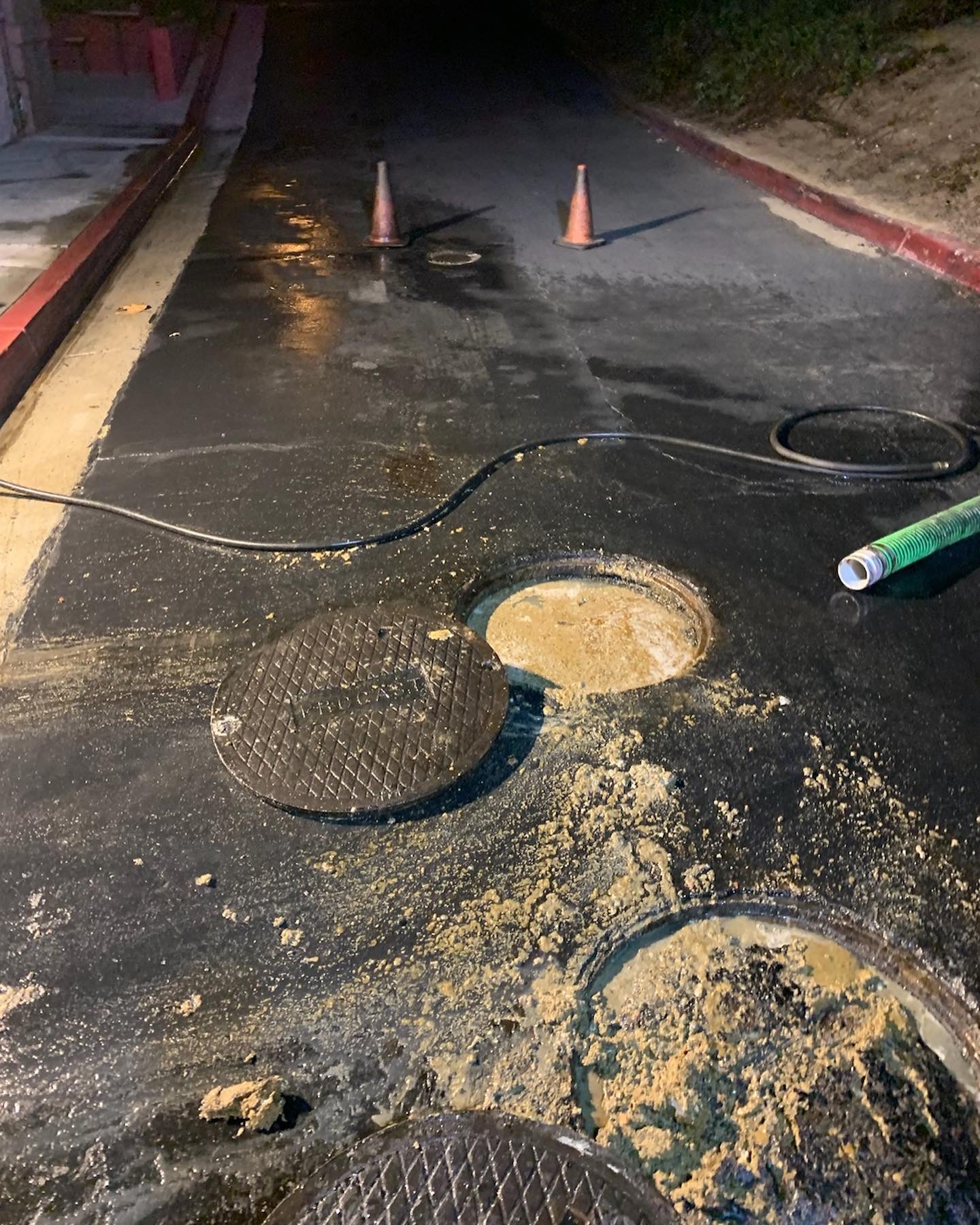 Grease overflowing during grease interceptor cleaning operation.