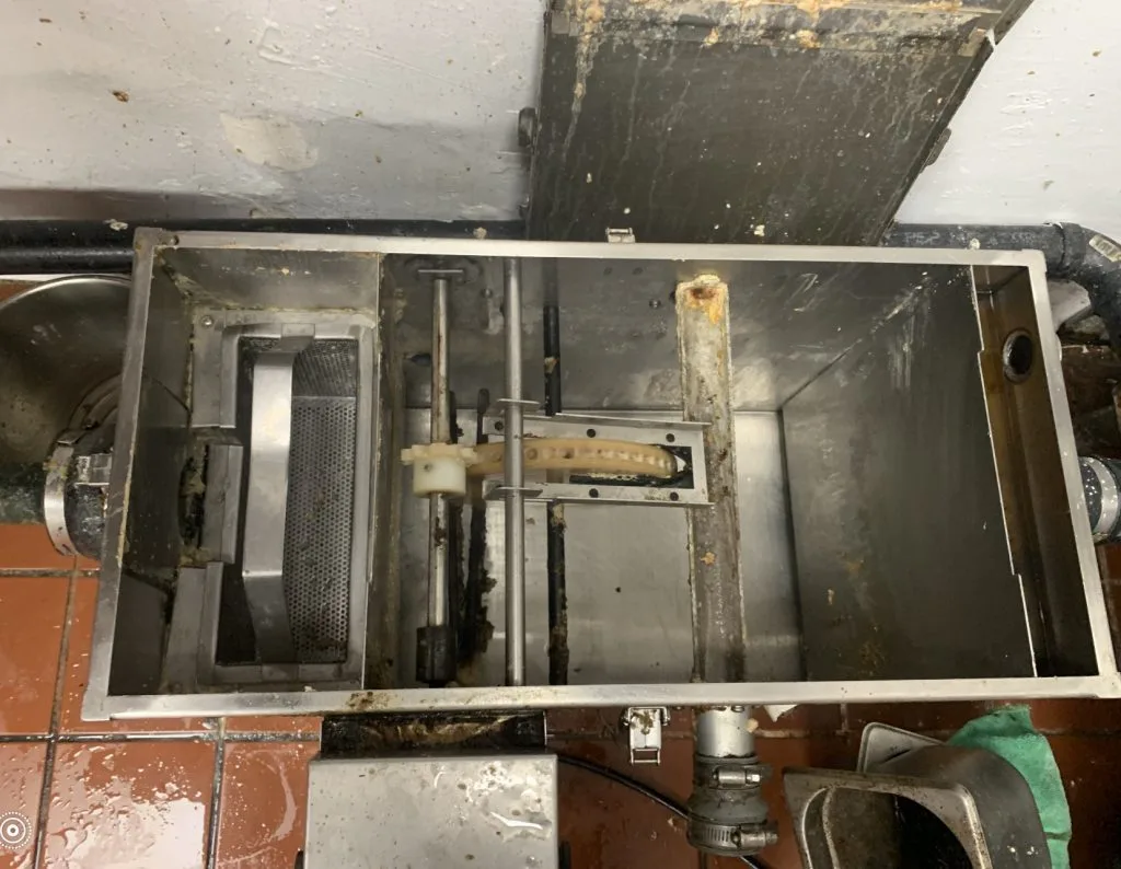 clean grease trap after professional grease trap cleaning in Los Angeles commercial kitchen