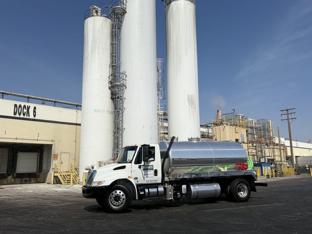 LA Grease Co service truck at used cooking oil recycling facility in Los Angeles County