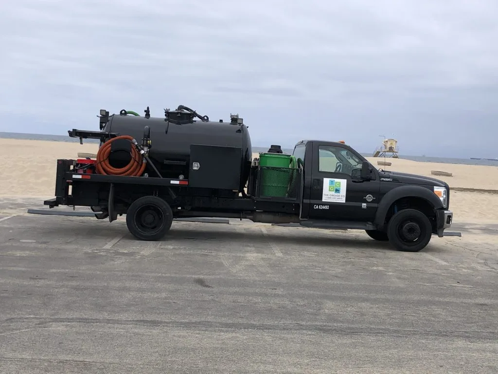 Los Angeles Grease Co grease trap pumping truck ready for commercial service outside restaurant