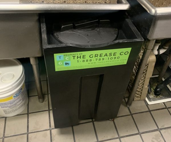 Commercial Grease Interceptor Services Commercial grease trap unit featuring the grease company logo who provides the best grease trap services in La